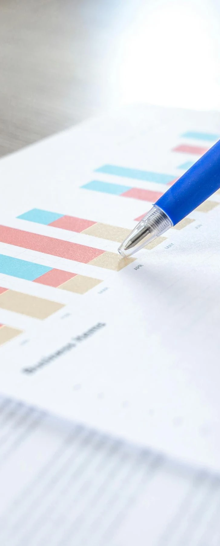 Bar charts and pen | Best survey tools for HR