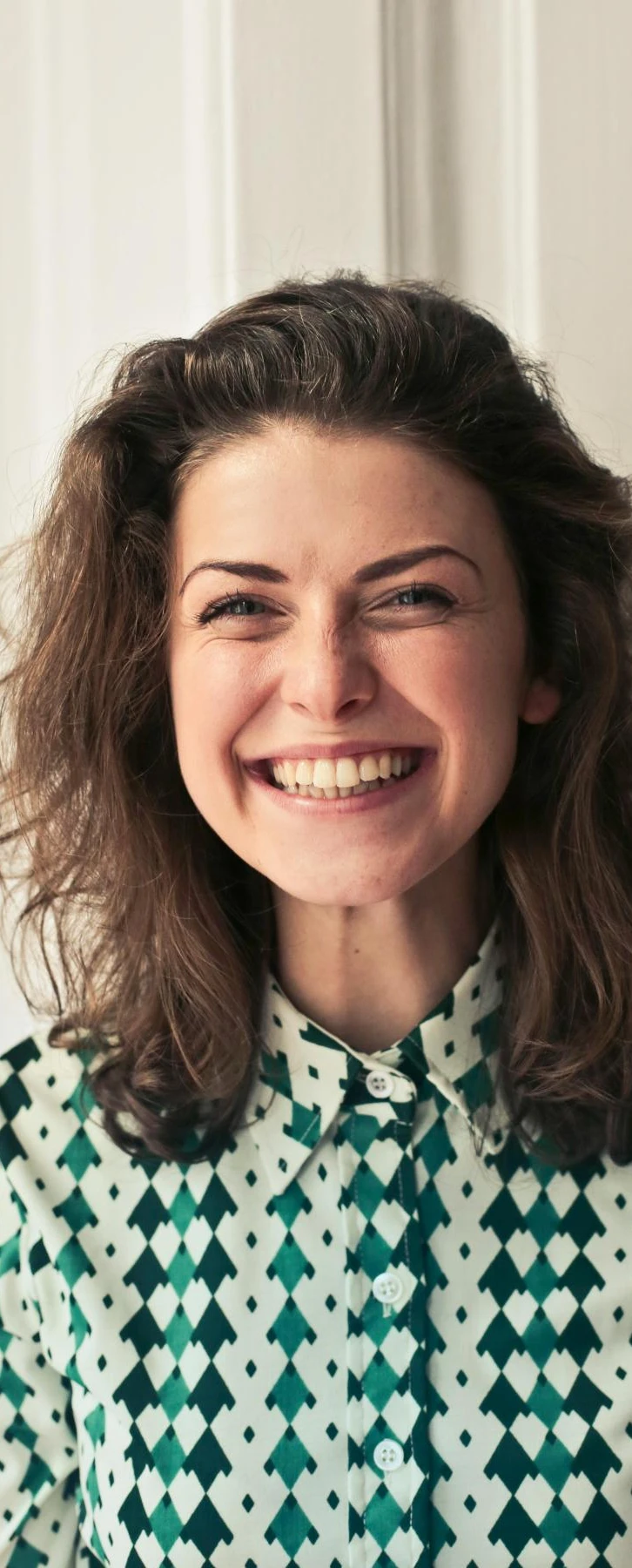 Woman smiling | Acknowledging employee achievements