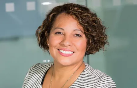 A woman smiling | What does a COO do?