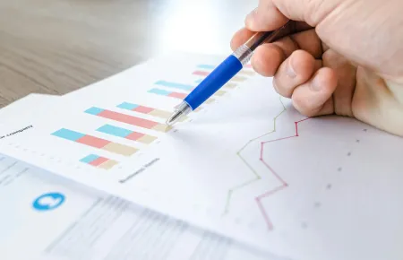 Bar charts and pen | Best survey tools for HR