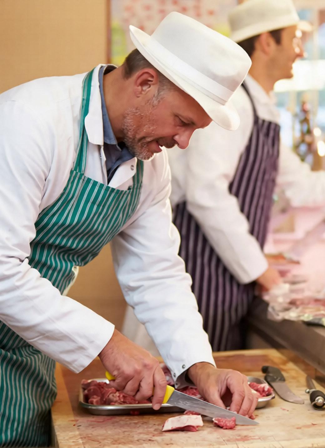 Butcher from quality foods of Aberdeen cutting meat